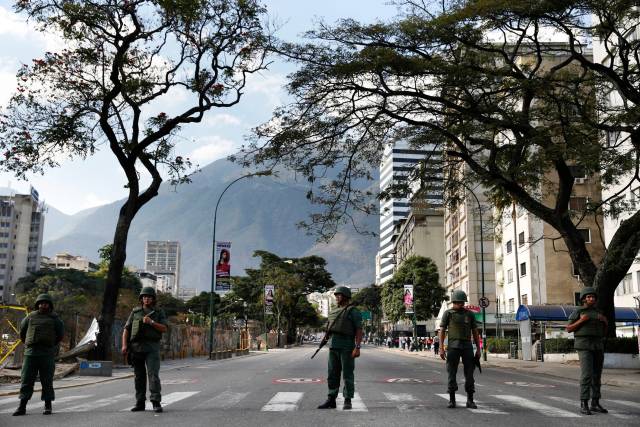 National Guards stand guard at Altamira square in Caracas