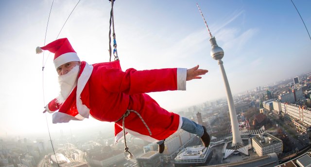 A man dressed as Santa Claus poses during a base flying event in downtown in Berlin