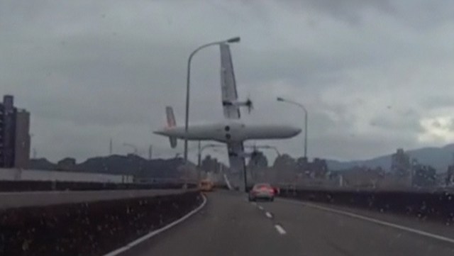 A still image taken from an amateur video shot by a motorist shows a TransAsia Airways plane cartwheeling over a motorway soon after the turboprop ATR 72-600 aircraft took off in New Taipei City