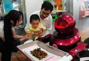 Inauguran restaurante chino con robots como camareros y cocineros