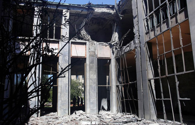 A picture taken on July 16, 2016 shows heavy damage at the Grand National Assembly of Turkey in Ankara after he was bombed by rebel jets. July 15 putsch bid began with rebel F-16 jets screaming low over rooftops in Ankara, soldiers and tanks taking to the streets and multiple explosions throughout the night in the capital as well as the biggest city Istanbul. With at least 2,839 soldiers already detained in a relentless round-up over the coup plot, the authorities blamed the conspiracy on Erdogan's arch enemy, the US-based cleric Fethullah Gulen. / AFP PHOTO / ADEM ALTAN