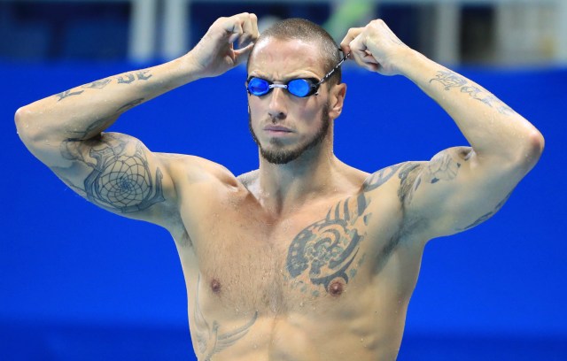 2016 Rio Olympics - Swimming - Preliminary - Olympic Aquatics Stadium - Rio de Janeiro, Brazil - 06/08/2016. Frederick Bousquet (FRA) of France adjusts his goggles. REUTERS/Dominic Ebenbichler FOR EDITORIAL USE ONLY. NOT FOR SALE FOR MARKETING OR ADVERTISING CAMPAIGNS.