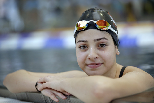 FILE - This is a Monday, Nov. 9, 2015 file photo of Yusra Mardini from Syria poses during a training session in Berlin, Germany. They?ve fled war and violence in the Middle East and Africa. They?ve crossed treacherous seas in small dinghies and lived in dusty refugee camps.They include a teenage swimmer Yusra Mardini from Syria, long-distance runners from South Sudan and judo and taekwondo competitors from Congo, Iran and Iraq. They are striving to achieve a common goal: To compete in the Olympics in Rio de Janeiro. Not for their home countries, but as part of the first ever team of refugee athletes.(AP Photo/Michael Sohn, File)