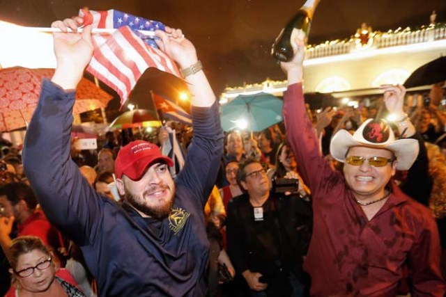 Cuban Americans celebrate upon hearing about the death of longtime Cuban leader Fidel Castro in the Little Havana neighborhood of Miami, Florida on November 26, 2016. Cuba's socialist icon and father of his country's revolution Fidel Castro died on November 25 aged 90, after defying the US during a half-century of ironclad rule and surviving the eclipse of global communism. / AFP PHOTO