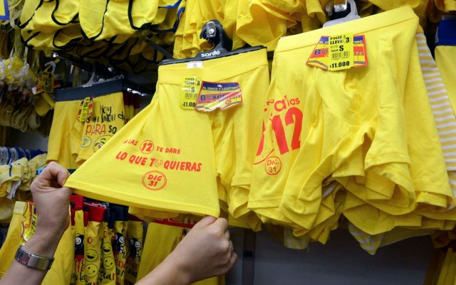 View of yellow underwear for sell at a store in Medellin, Colombia, on December 29, 2016, where tradition holds that it brings prosperity and good luck if you wear it on New Year's Eve. / AFP PHOTO / CAMILO GIL