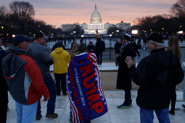 Supporters of U.S. President-elect Donald Trump gather in the foreground of the U.S. Capitol on the National Mall before Trump is to be sworn in in Washington U.S., January 20, 2017. REUTERS/Shannon Stapleton