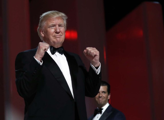 President Donald Trump acknowledges the crowd at the Liberty Ball, Friday, Jan. 20, 2017, in Washington. (AP Photo/Alex Brandon)