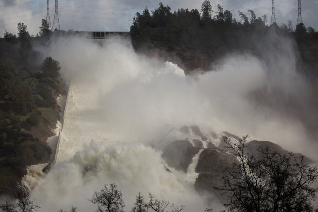 65,000 cfs of water flow through a damaged spillway on the Oroville Dam in Oroville, California, U.S., February 10, 2017. REUTERS/Max Whittaker
