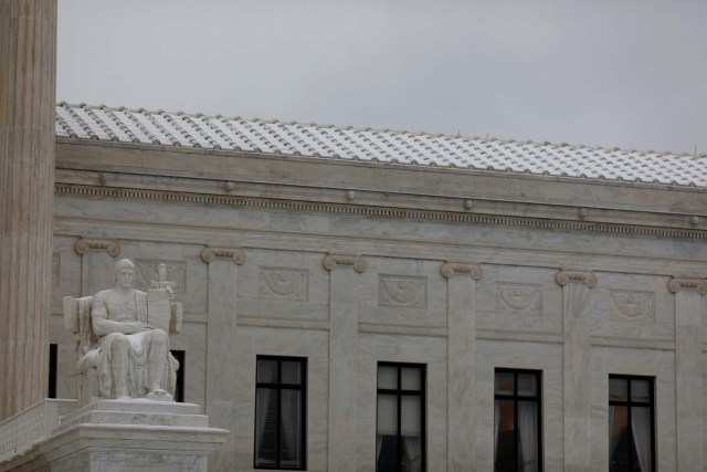 A light coating of snow is seen on the Supreme Court in Washington, D.C., U.S. March 14, 2017. REUTERS/Aaron P. Bernstein