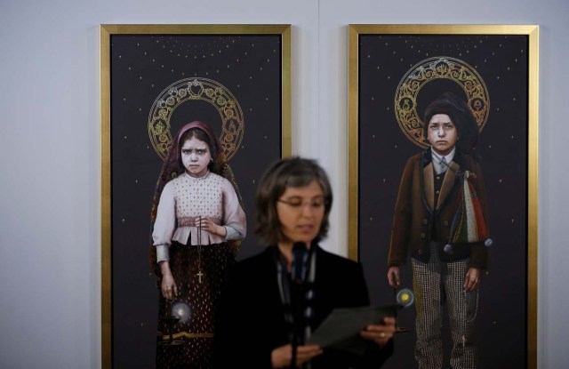 Two paintings of young shepherds Francisco and Jacinta, who reported the 1917 apparition of the Virgin Mary, are presented in Fatima, Portugal May 8, 2017. REUTERS/Rafael Marchante FOR EDITORIAL USE ONLY. NO RESALES. NO ARCHIVES.
