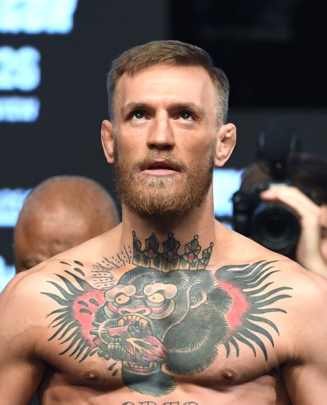 LAS VEGAS, NV - AUGUST 25: UFC lightweight champion Conor McGregor stands on the scale during his official weigh-in at T-Mobile Arena on August 25, 2017 in Las Vegas, Nevada. McGregor will meet boxer Floyd Mayweather Jr. in a super welterweight boxing match at T-Mobile Arena on August 26. Ethan Miller/Getty Images/AFP