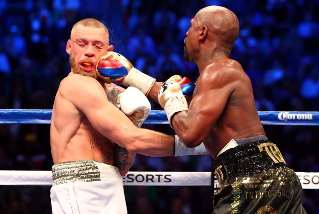 Aug 26, 2017; Las Vegas, NV, USA; Floyd Mayweather Jr. lands a hit against Conor McGregor during the tenth round at T-Mobile Arena. Mandatory Credit: Mark J. Rebilas-USA TODAY Sports TPX IMAGES OF THE DAY TPX IMAGES OF THE DAY