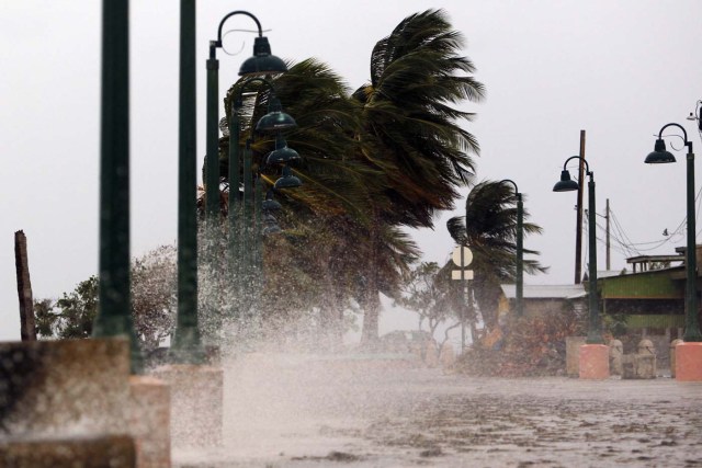 Winds lash the coastal city of Fajardo as Hurricane Maria approaches Puerto Rico, on September 19, 2017. Maria headed towards the Virgin Islands and Puerto Rico after battering the eastern Caribbean island of Dominica, with the US National Hurricane Center warning of a "potentially catastrophic" impact. / AFP PHOTO / Ricardo ARDUENGO