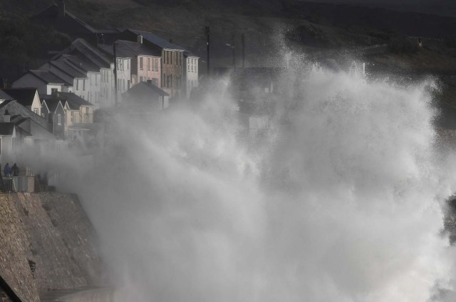 Large waves crash along sea defences and the harbour as Storm Ophelia approaches Porthleven in Cornwall, south west Britain, October 16, 2017. REUTERS/Toby Melville