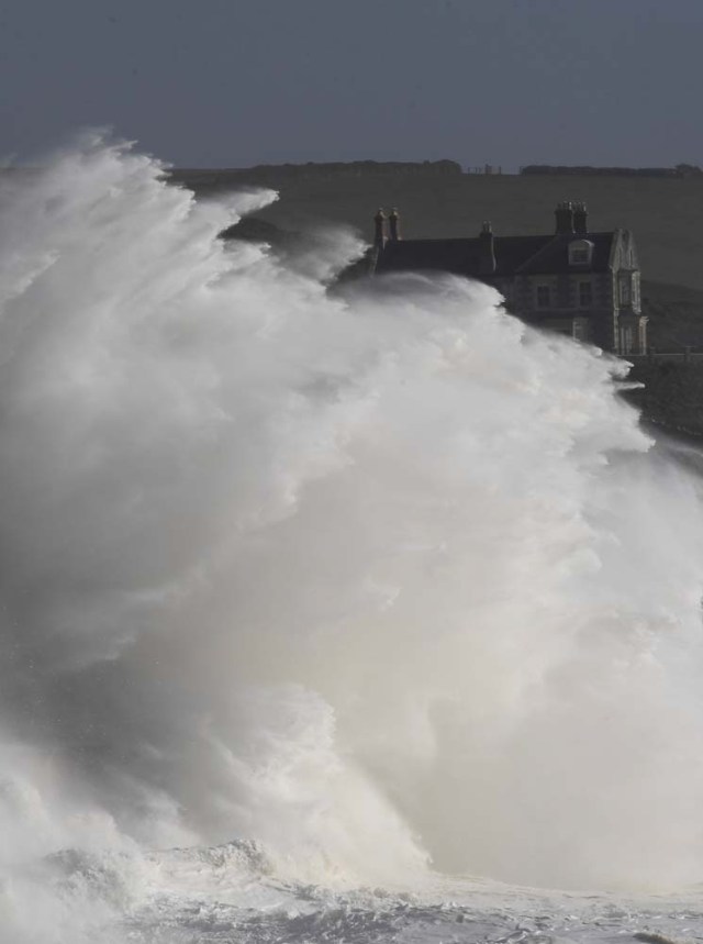 Large waves crash along sea defences and the harbour as Storm Ophelia approaches Porthleven in Cornwall, south west Britain, October 16, 2017. REUTERS/Toby Melville