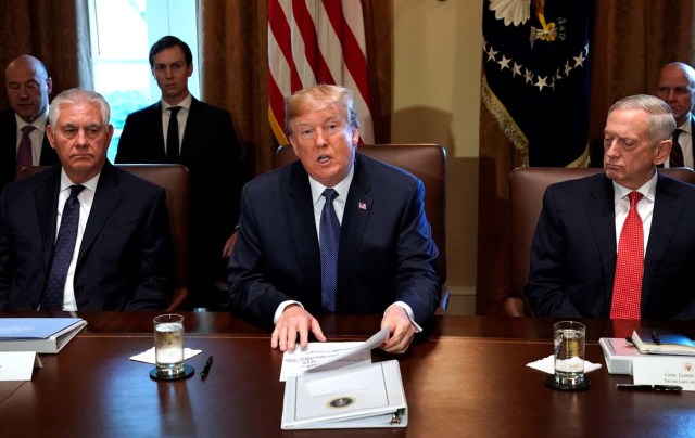 U.S. President Donald Trump speaks during a cabinet meeting, flanked by Secretary of State Rex Tillerson (L) and Secretary of Defense James Mattis (R), at the White House in Washington, U.S., November 1, 2017.  REUTERS/Kevin Lamarque