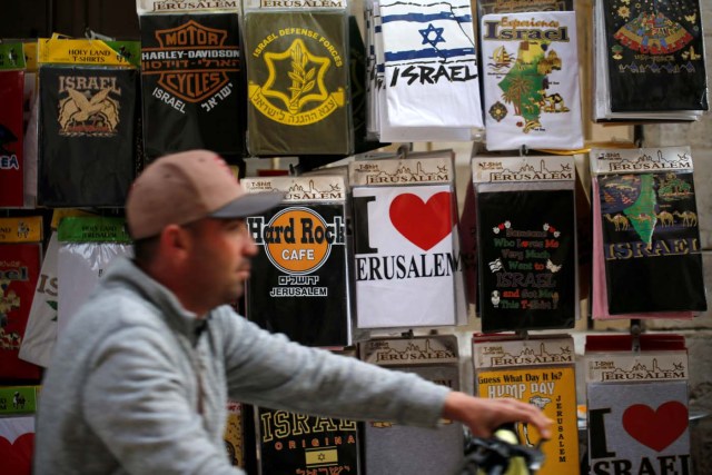 A man rides bicycle in a street in Jerusalem's Old City December 5, 2017 REUTERS/Ammar Awad