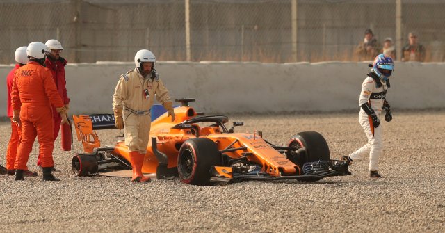 F1 Formula One - Formula One Test Session - Circuit de Barcelona Catalunya, Montmelo, Spain - February 26, 2018 Fernando Alonso of McLaren walks away from his car after a tyre fell off during testing REUTERS/Albert Gea