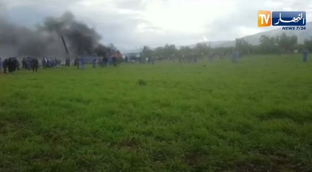Smoke rises at the scene where a plane crashed into a field outside Algiers, Algeria April 11, 2018 in this still image taken from a video. ENNAHAR TV/Handout/ via REUTERS  THIS IMAGE HAS BEEN SUPPLIED BY A THIRD PARTY. ALGERIA OUT. NO COMMERCIAL OR EDITORIAL SALES IN ALGERIA. NO RESALES. NO ARCHIVES.