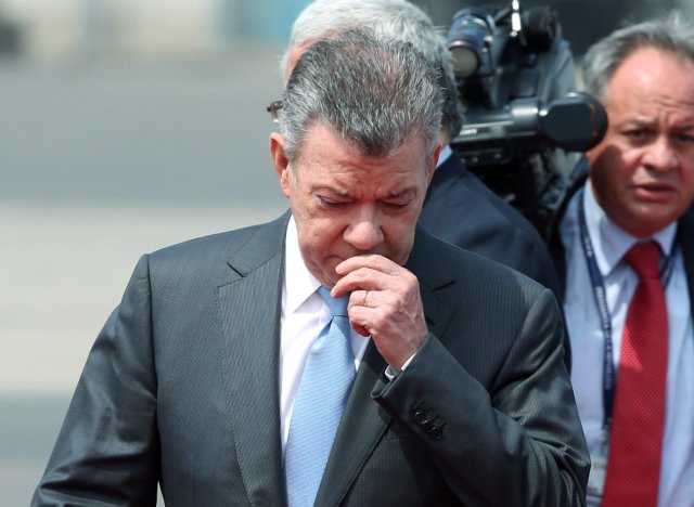 Colombia's President Juan Manuel Santos arrives for upcoming Summit of the Americas at the airport in Lima, Peru, April13, 2018. REUTERS/Guadalupe Pardo