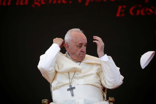 A gust of wind blows Pope Francis's skull cap off during his pastoral visit in Alessano, southern Italy, April 20, 2018. REUTERS/Max Rossi