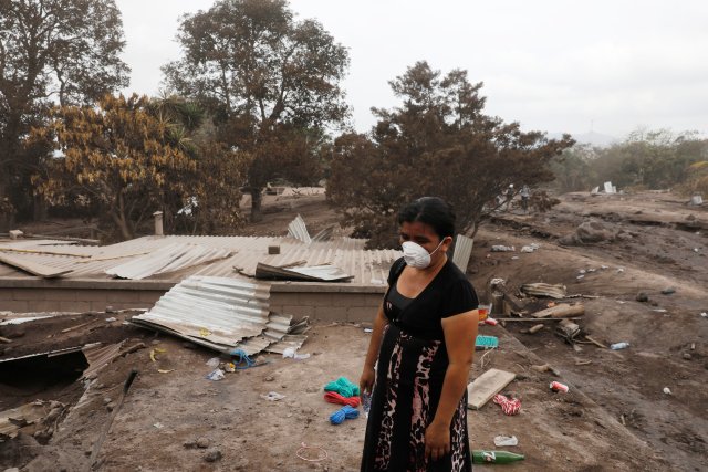 A resident is seen at an area affected by the eruption of Fuego volcano in San Miguel Los Lotes in Escuintla, Guatemala, June 7, 2018. REUTERS/Carlos Jasso