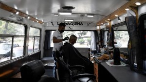 Venezuelan barber mounts mobile shop amid economic crisis